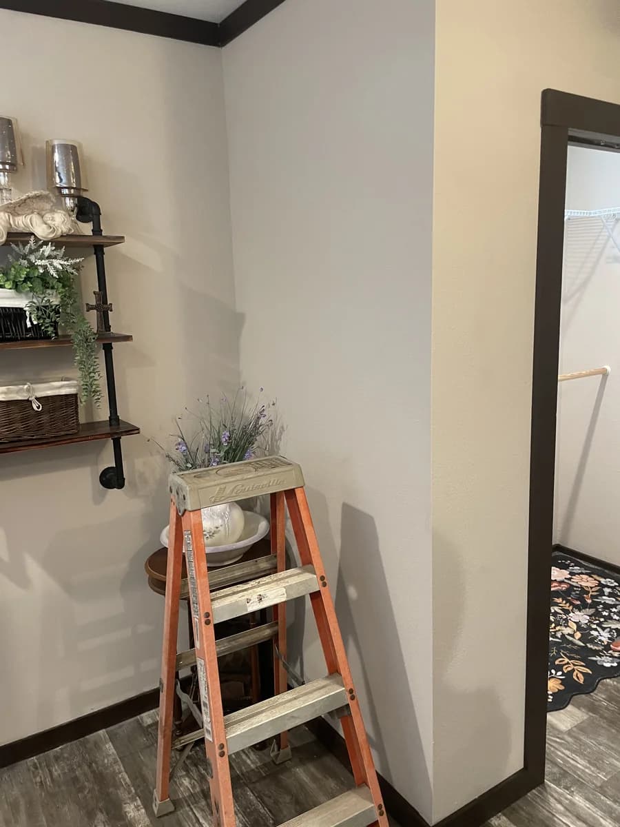 Handyman working on interior paint and trim in a Palestine, TX home — Handy Hands Handyman